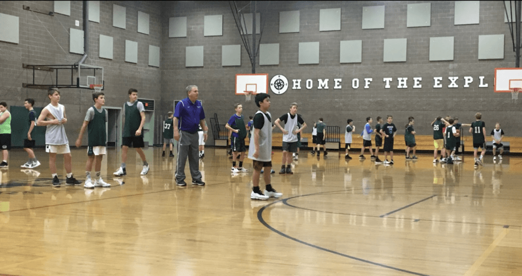 7th grade boys basketball playing a game.